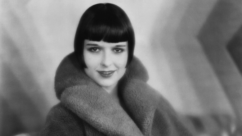Louise Brooks in a fur coat with her signature bobbed haircut