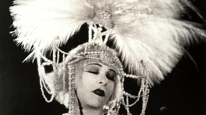 Alla Nazimova wearing an elaborate feather and beaded headdress