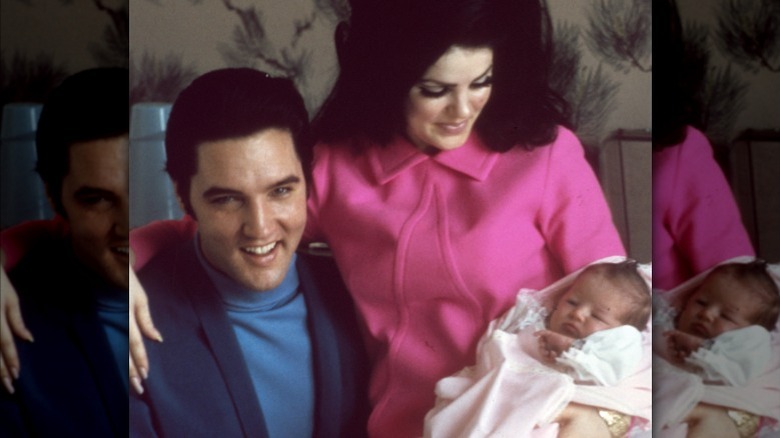 Elvis and Priscilla posing with baby Lisa Marie