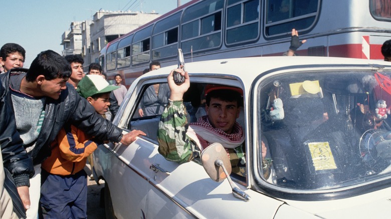 Hamas member in car holding pistol