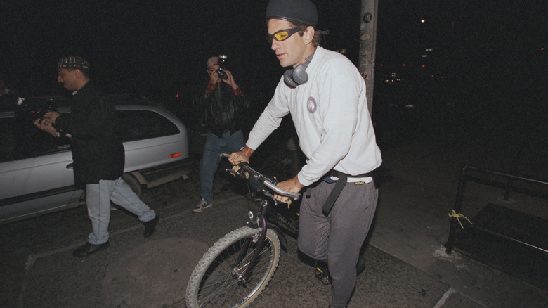 JFK Jr moves his bike