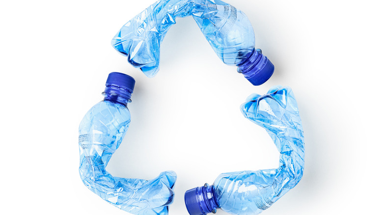 Recycle symbol made from plastic bottles.