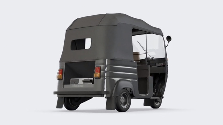 Electric rickshaw showing swappable battery compartment.