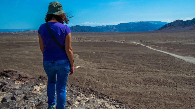 Woman observing Nazca lines