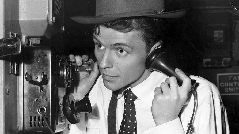 Frank Sinatra in hat with telephone