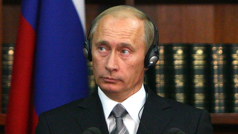 Vladamir Putin wearing headphones 