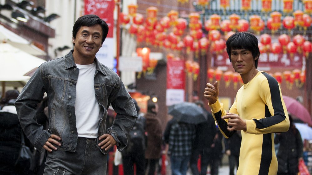 Jackie Chan and statue of Bruce Lee