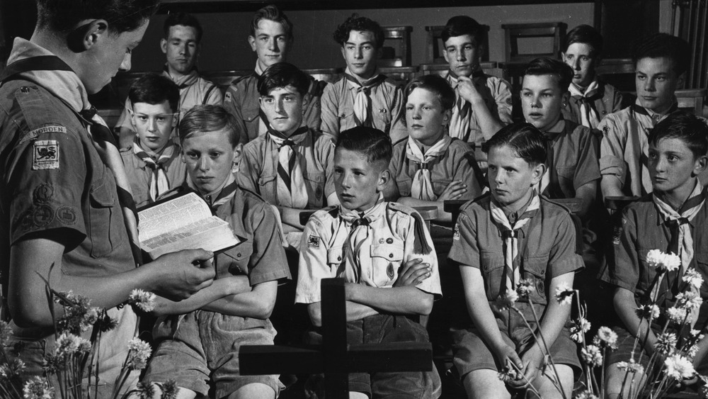 Boy Scouts attending prayer meeting