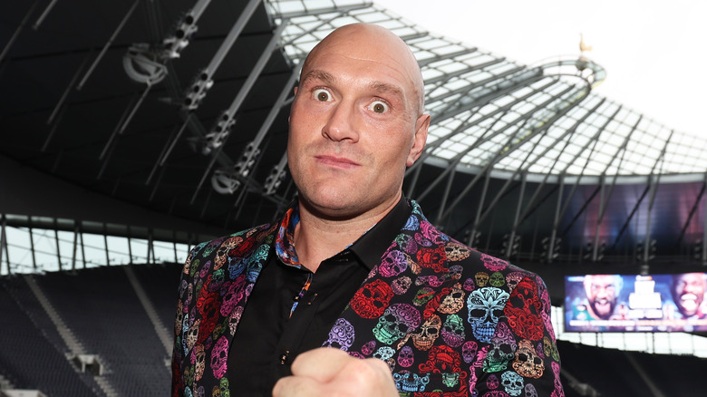tyson fury posing during a press conference