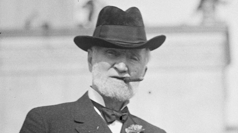 Joseph Gurney Cannon chomping a cigar dark hat