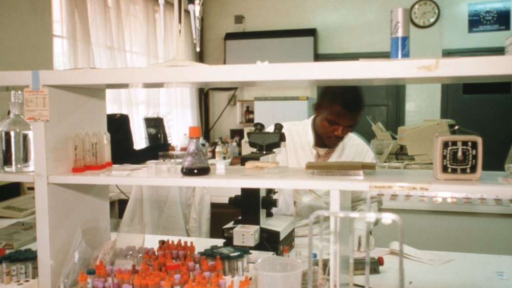 A technician performs blood analysis October 22, 1997 in Kinshasa, Democratic Republic of the Congo. 
