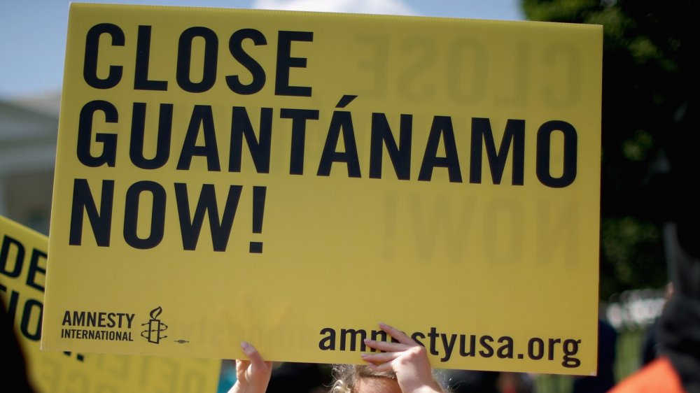 Demonstrators hold a rally to urge President Barack Obama to fulfill his pledge to close the military prison at Guantanamo Bay, Cuba, and end indefinite detention