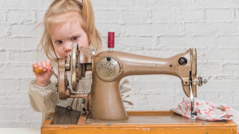 Girl and sewing machine
