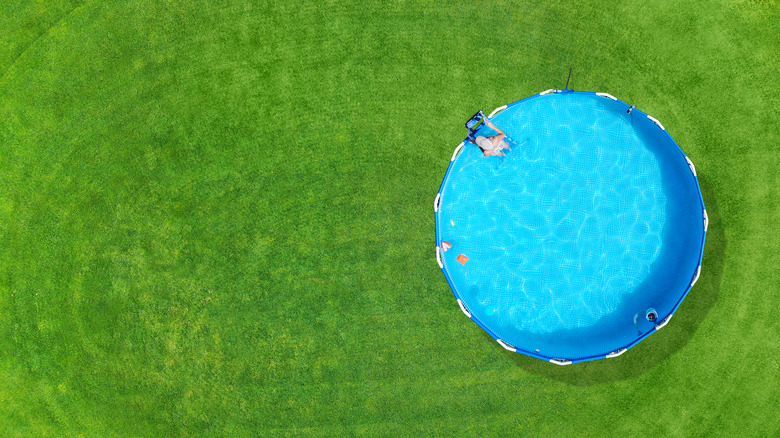 An aboveground pool on a lawn