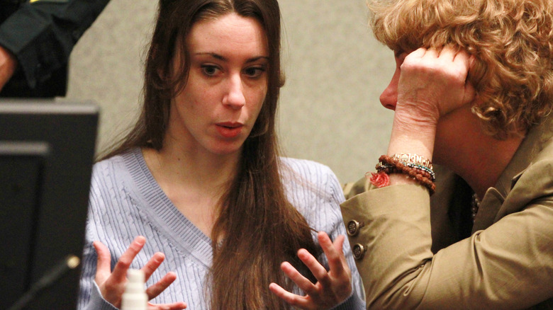 Casey Anthony looks down and speaks