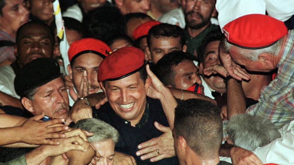Hugo Chavez surrounded by supporters
