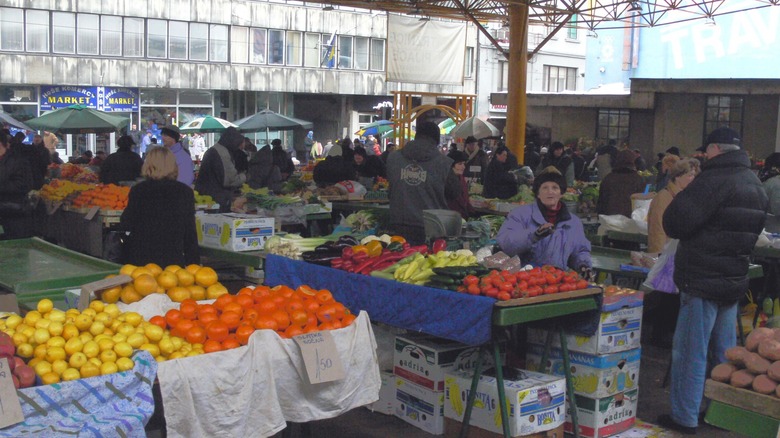 People at Markale market buying goods