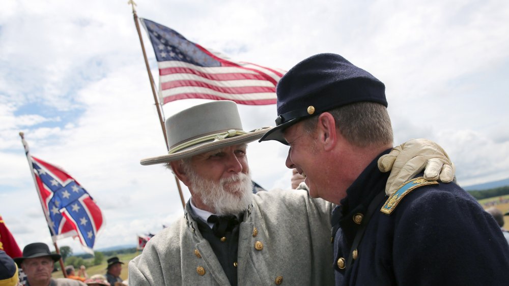 Union and Confederate  soldiers shaking hands