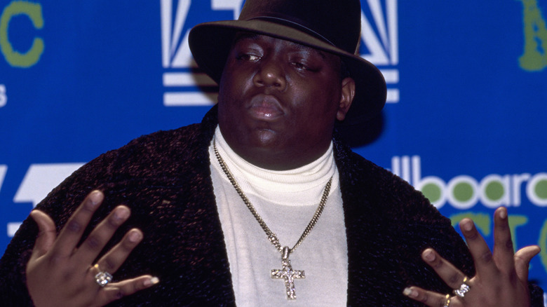 Christopher Wallace in cadigan and fedora