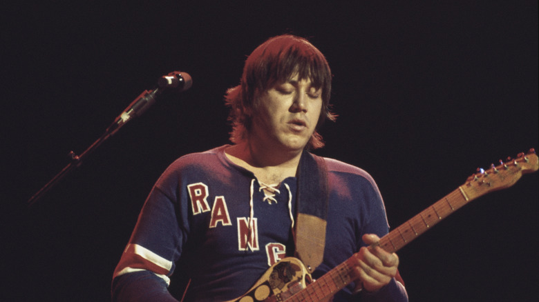 Terry Kath playing guitar on stage