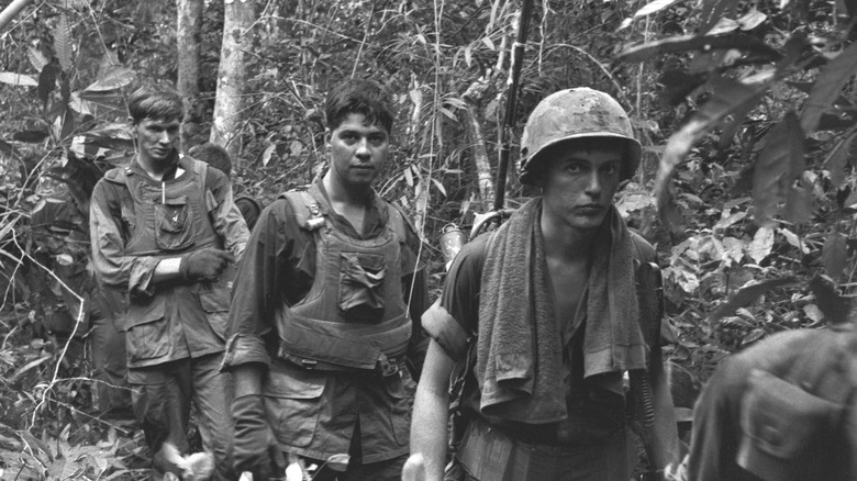 soldiers in vietnam jungle walking