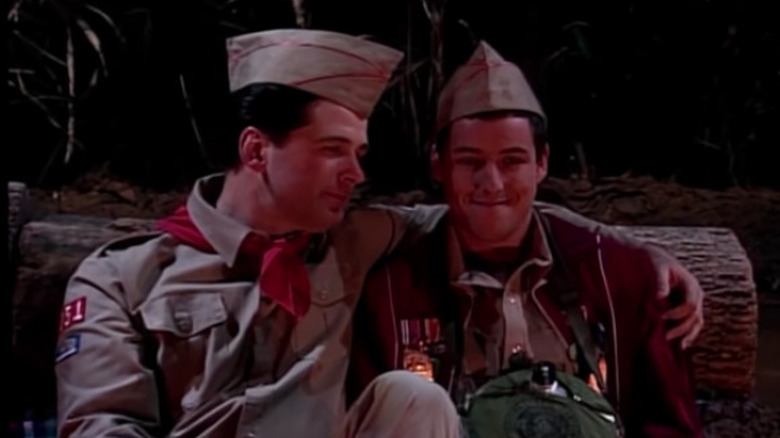 Alex Baldwin and Adam Sandler sat in scout uniforms