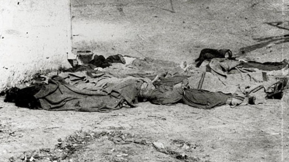 bodies laying on ground after chinese massacre