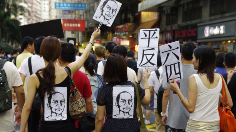 Hong Kong protesters holding signs