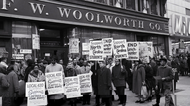 protestors picketing in front of Woolworth's