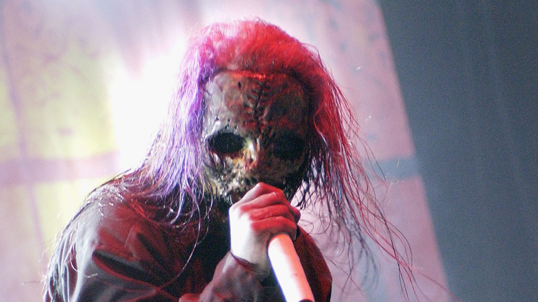 Slipknot on stage with masks long hair