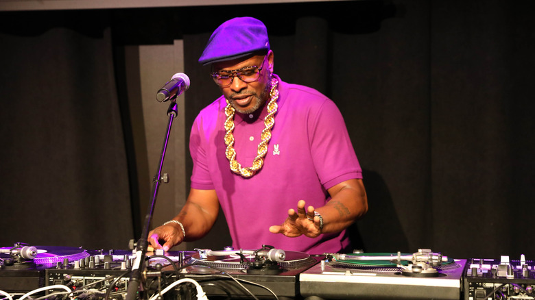 DJ Jazzy Jeff on the turntables purple shirt gold chain