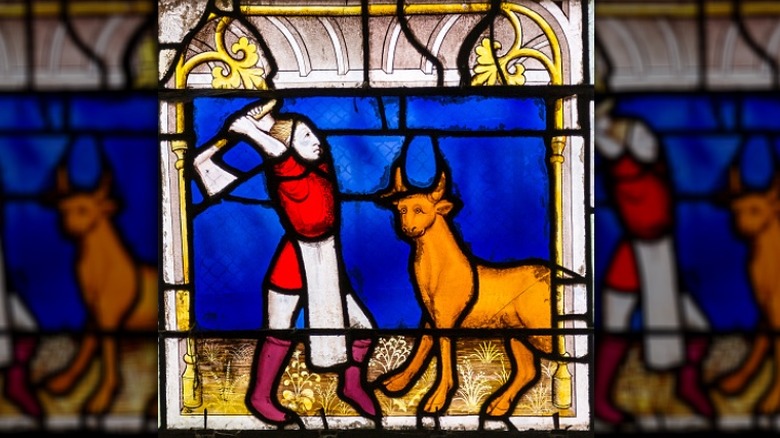 Butcher killing cow, stained glass