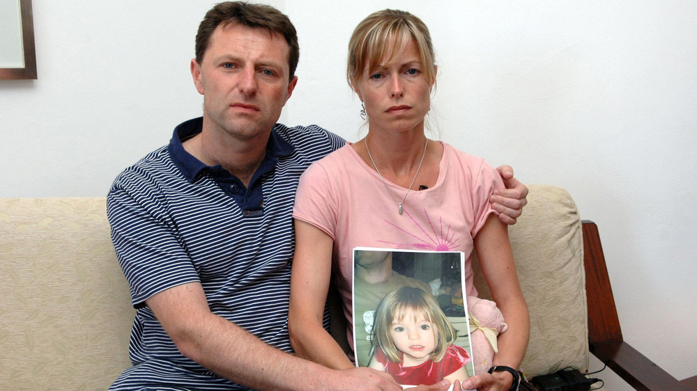 The McCanns with a photo of their missing daughter, Madeleine
