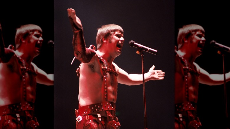 Ozzy Osbourne singing onstage short hair costume
