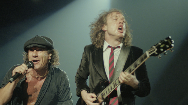 Johnson sings next to Angus Young