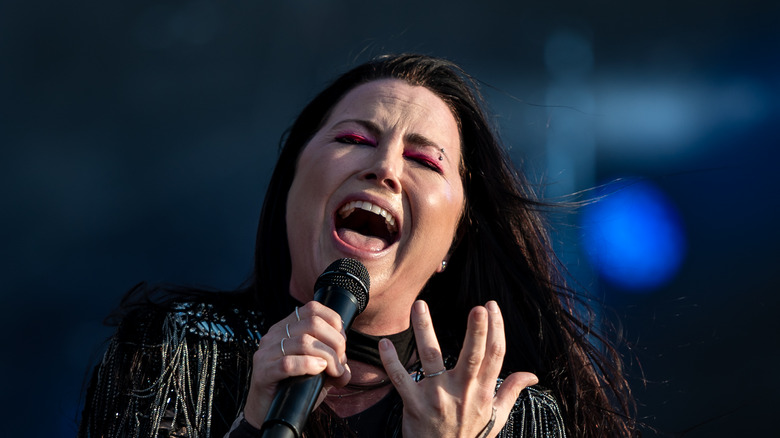 Amy Lee sings into mic