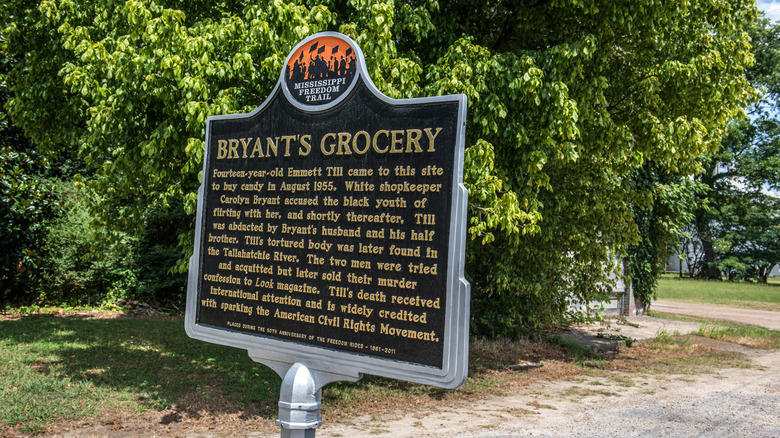 Memorial sign at the site of Bryant's Grocery