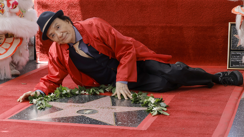 James Hong red shirt lying on Hollywood Walk of Fame