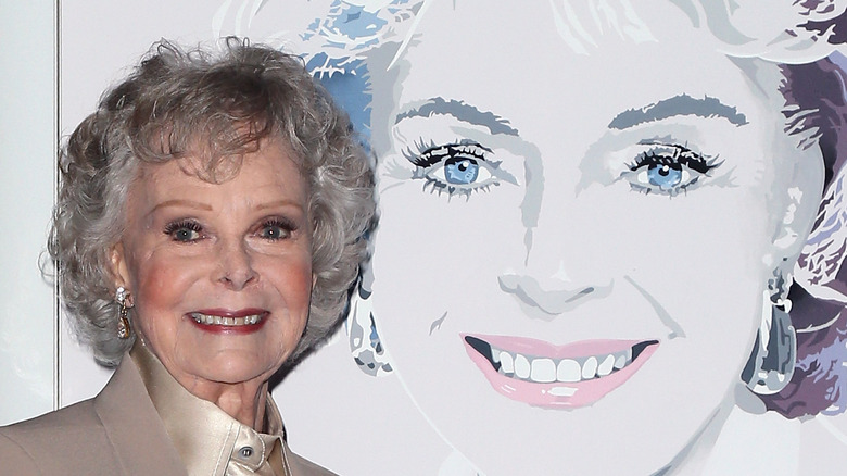 June Lockhart smiling with her portrait