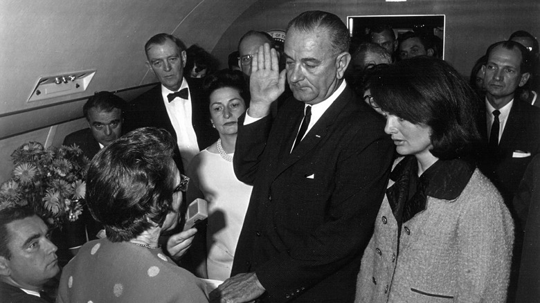 Lyndon B. Johnson being sworn in 