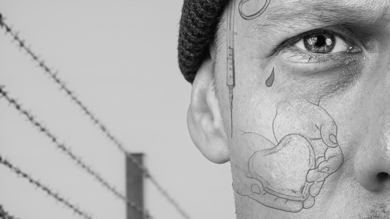 Prisoner with teardrop tattoo