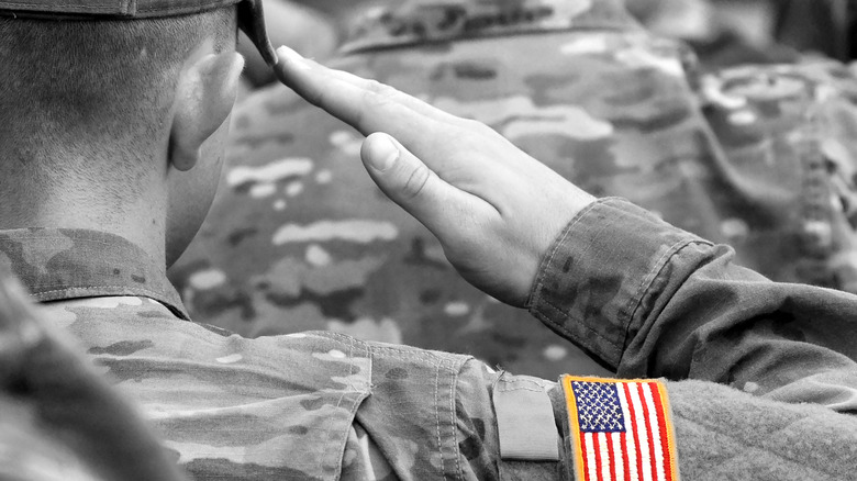 Soldier saluting in uniform