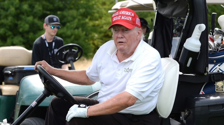 Trump riding in golf cart