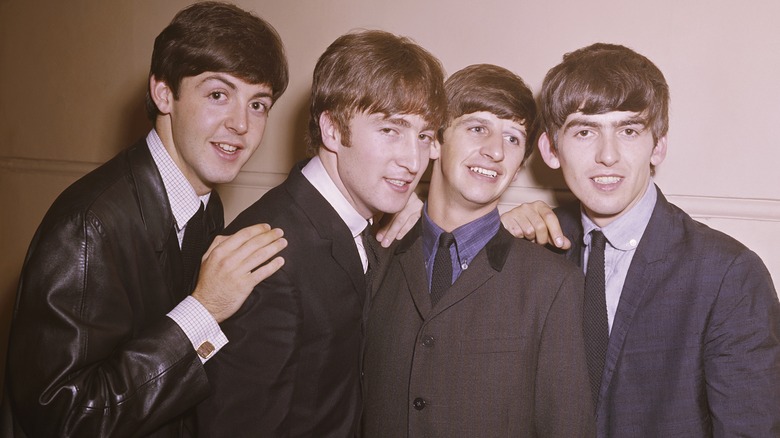 Beatles posing band photo 1964