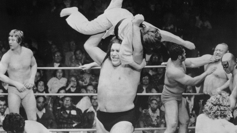 Andre the Giant tossing man out of ring