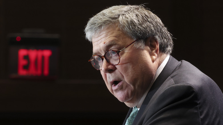 William Barr with exit sign