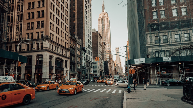 New York City street scene with Empire State Building in distance