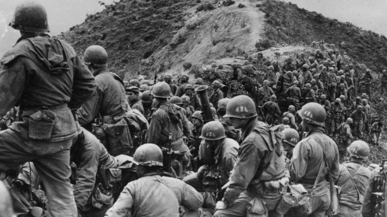 U.S. soldiers gathered on ridge