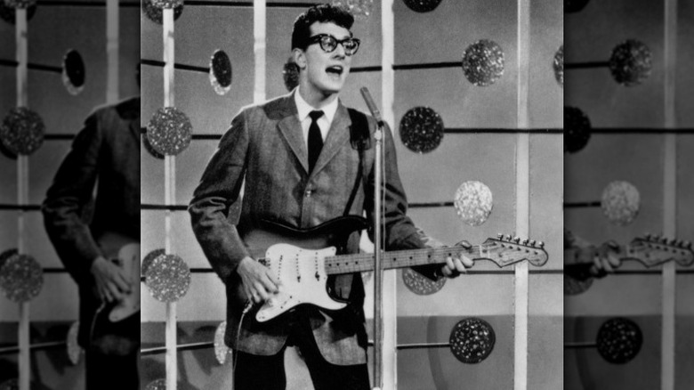 Buddy Holly suited glasses performing with Stratocaster