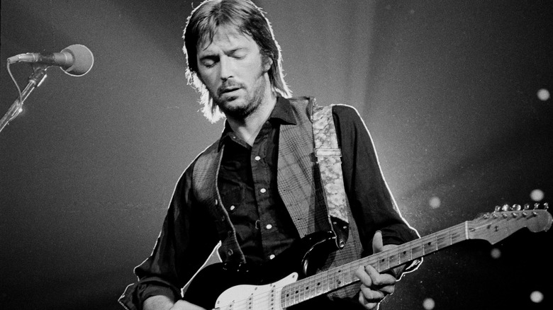 Eric Clapton on stage playing a Stratocaster